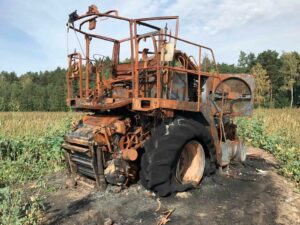 Burned wheat harvester after harvesting hemp field